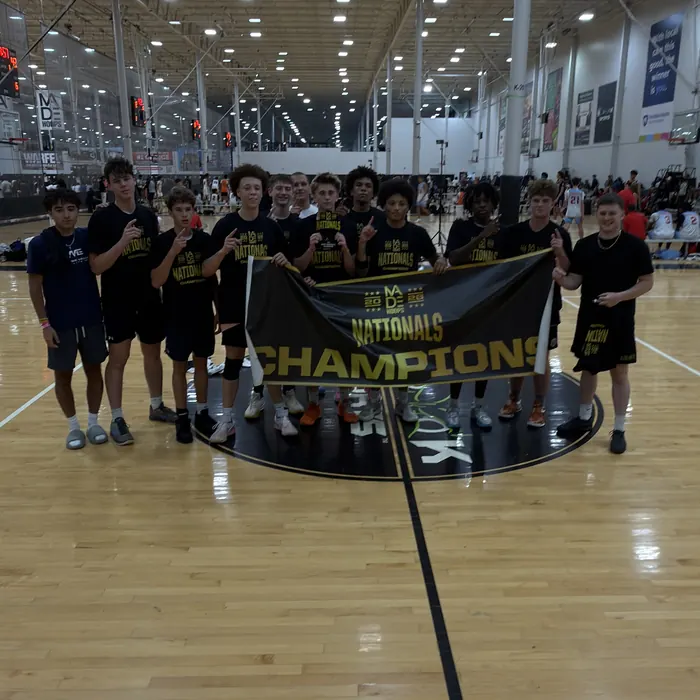 MVE 16U holding the Made Hoops Nationals champions banner at center court