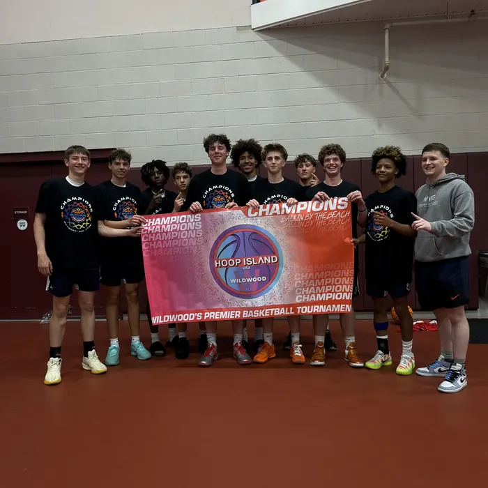 MVE players holding the Hoop Island champions banner in Wildwood