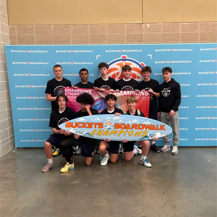 MVE players with the Buckets by the Boardwalk champions surfboard trophy