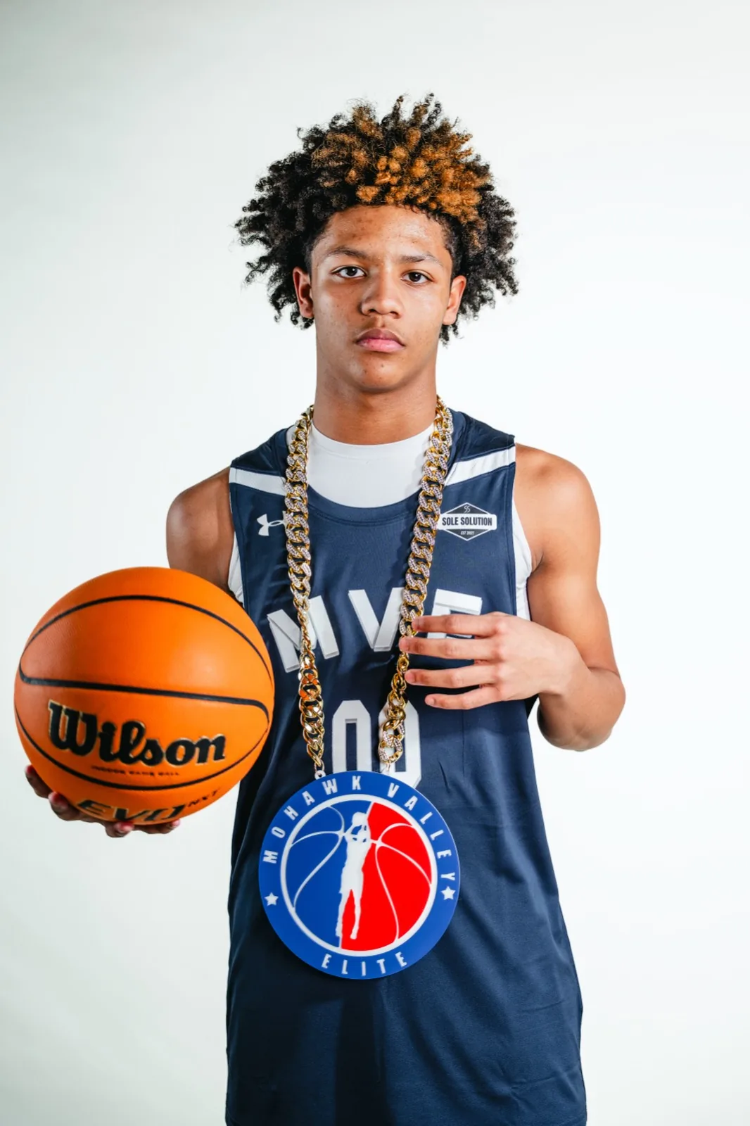 MVE player with the player-of-the-game chain at 2026 media day