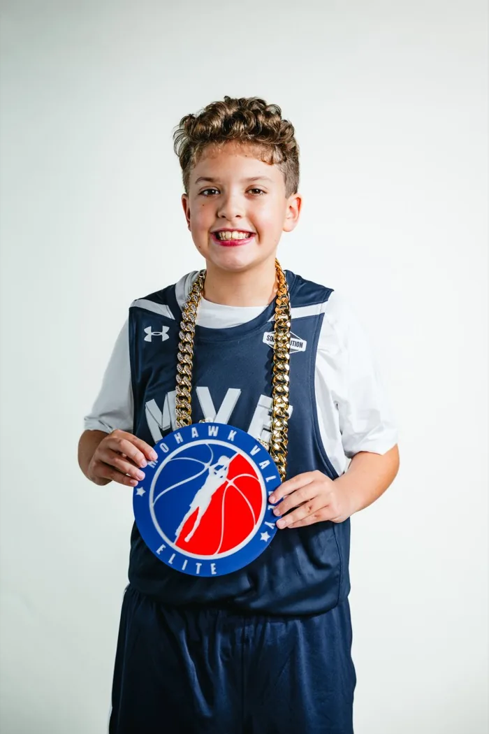 MVE player wearing the player-of-the-game chain at 2026 Media Day