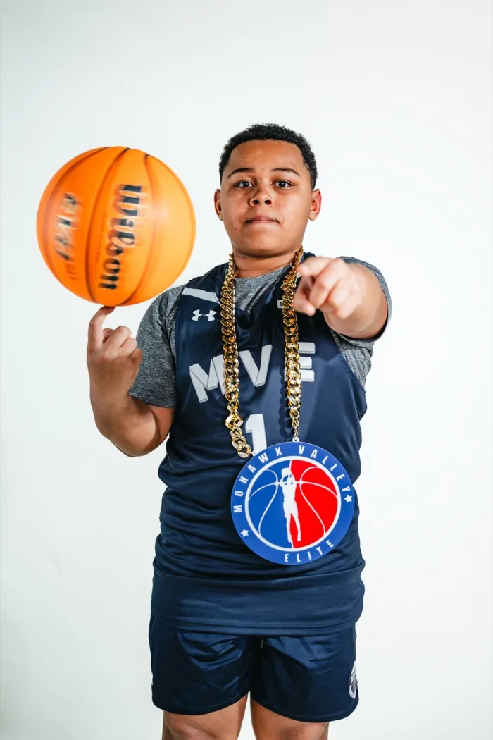 MVE player spinning a basketball on one finger and pointing at the camera at 2026 Media Day