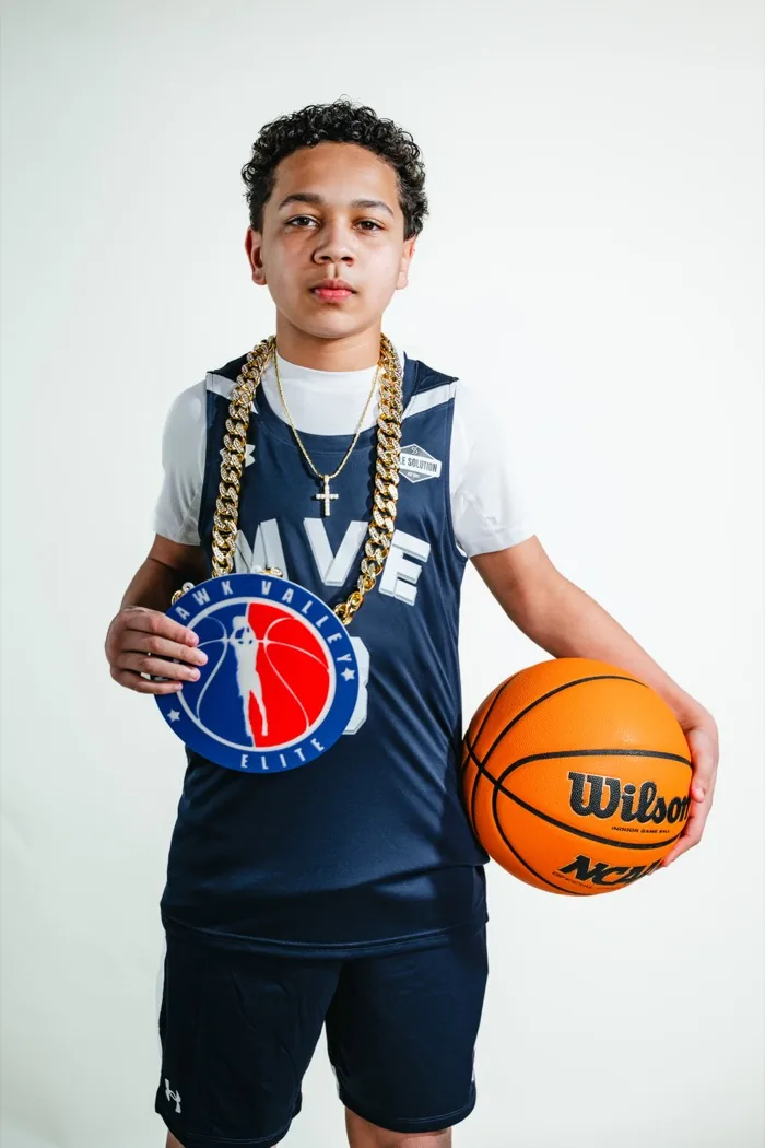 MVE player with the chain and a basketball at 2026 Media Day
