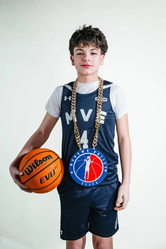 MVE player wearing the player-of-the-game chain at 2026 Media Day
