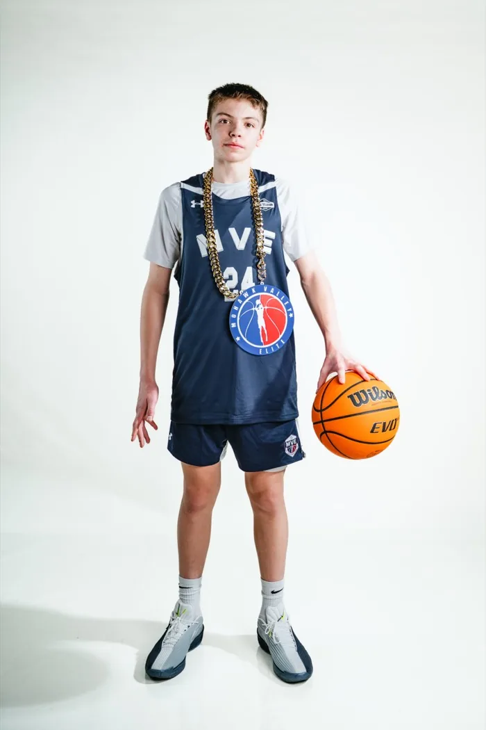 MVE player wearing the chain and holding a basketball at his side at 2026 Media Day