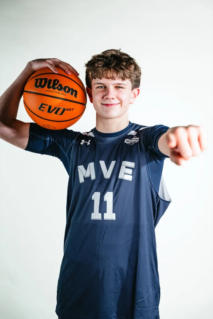 MVE player pointing at the camera with a basketball at 2026 Media Day