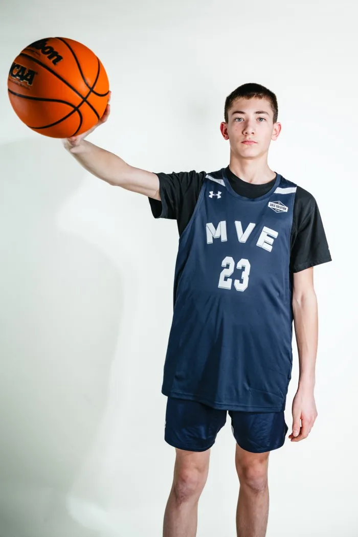 MVE player holding a basketball out on his fingertips at 2026 Media Day